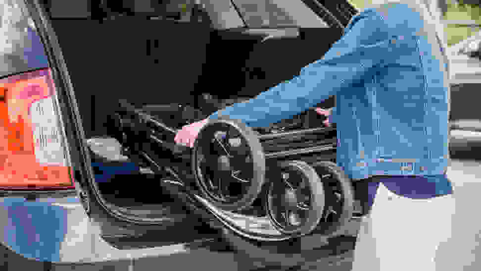 Taking a stroller out of a car trunk