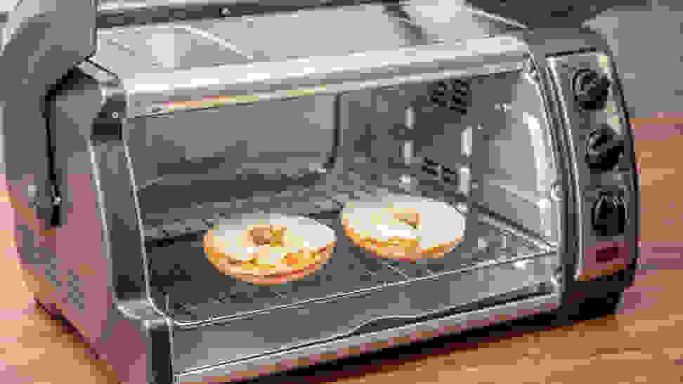 Bagel toasting in a toaster oven.