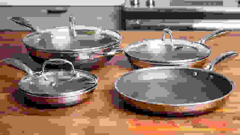 HexClad pots and pans sit on a kitchen counter.