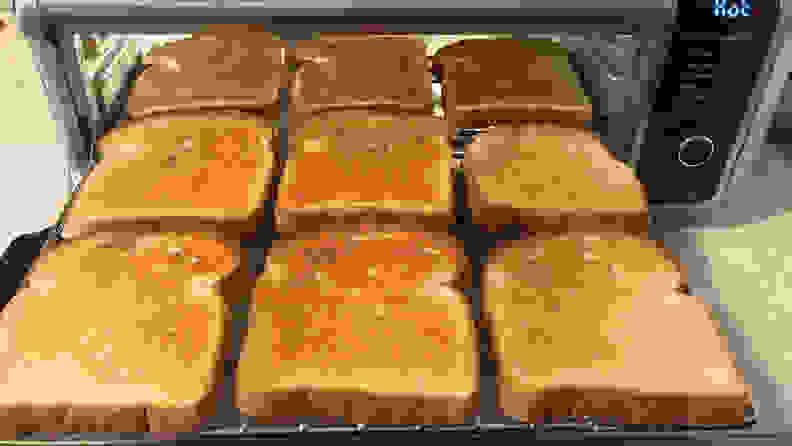 Nine pieces of evenly browned toast sit in the Ninja Foodi oven.