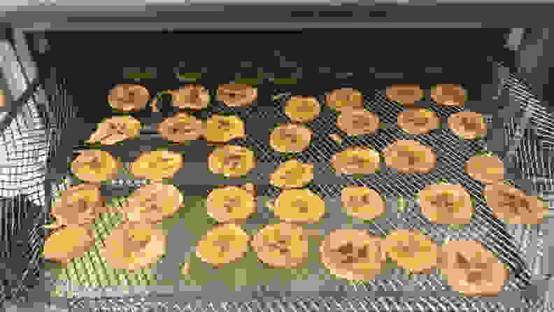 A tray of banana chips comes out of the Ninja Foodi oven.