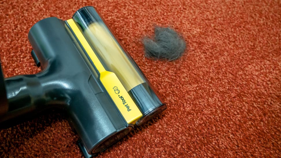 The Samsung Bespoke Jet AI Pet Tool cleaning dog hair off a carpet.