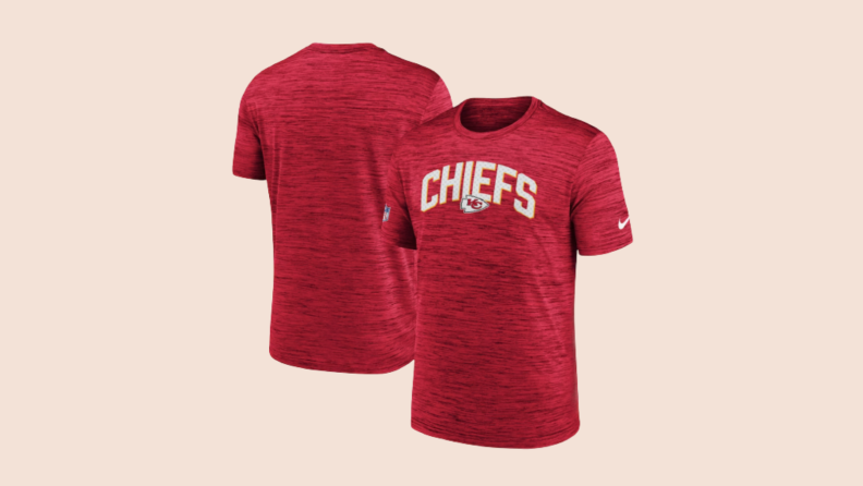 Front and back of red Kansas City Chiefs shirt against beige background