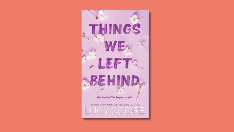 An image of the cover of 'Things We Left Behind' by Lucy Score, featuring the title in dark purple text on a lavender background.