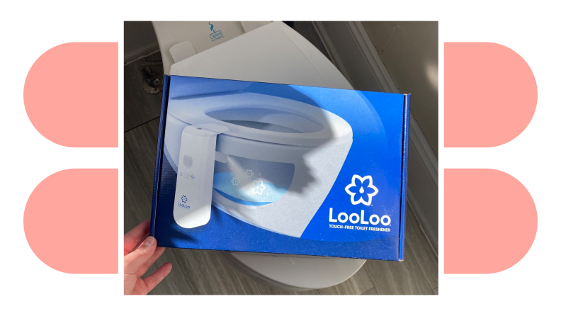A hand holding the packaging box for the Loo Loo toilet spray.