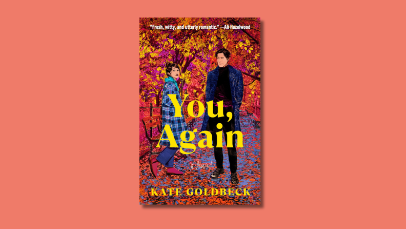 An image of the book cover of 'You, Again' by Kate Goldbeck, featuring two people on a tree-lined street in the autumn.