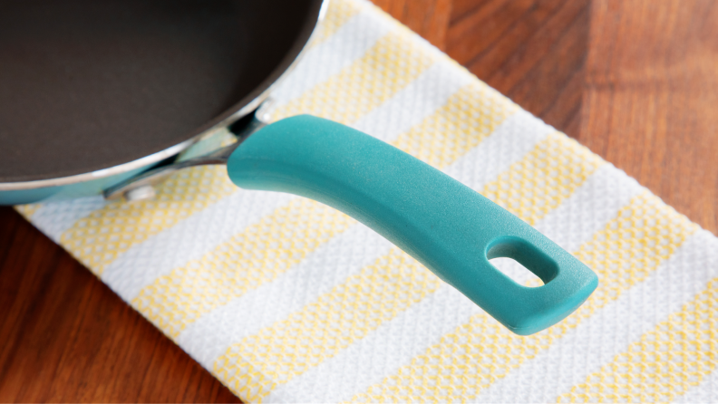 Close up of lightweight handle on side of nonstick skillet pan in Agave blue color.