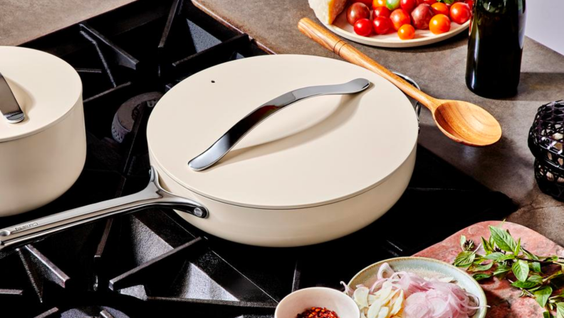A white ceramic pan on a stovetop.