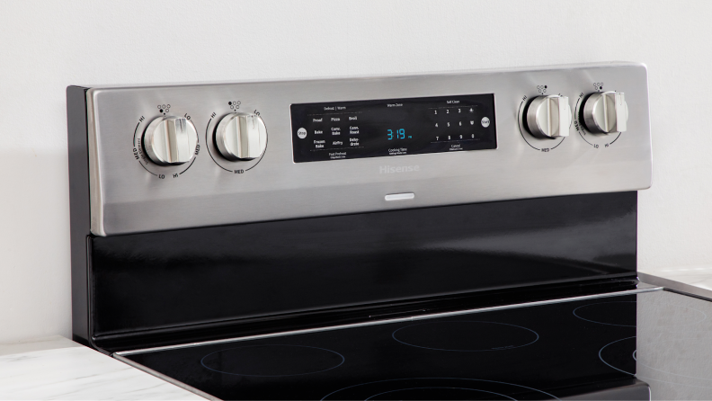 Close-up shot of the control panel on the Hisense HBE3501CPS 30-in Freestanding Electric Range.